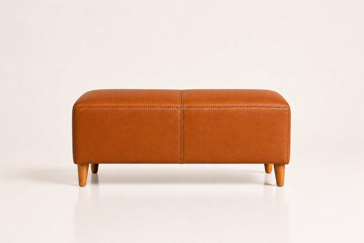 the BETTIE ottoman in dark tan brown full-grain leather (HONEY SAND)