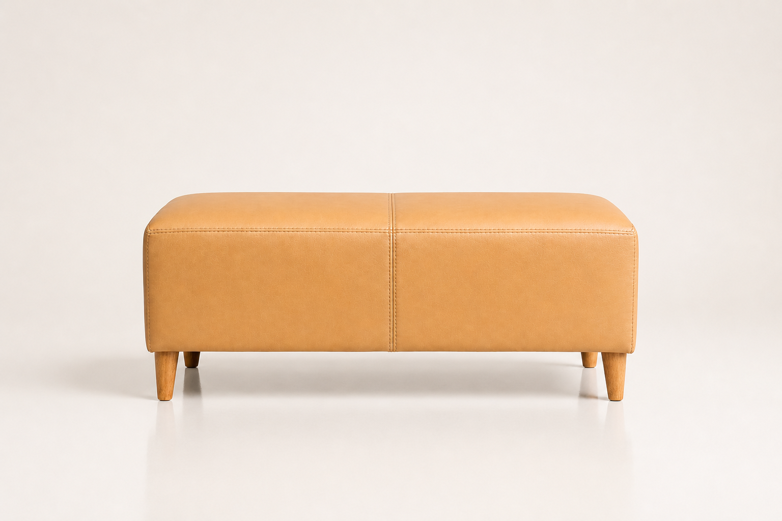 the BETTIE ottoman in soft caramel tan full-grain leather (SAVANNAH DREAM)