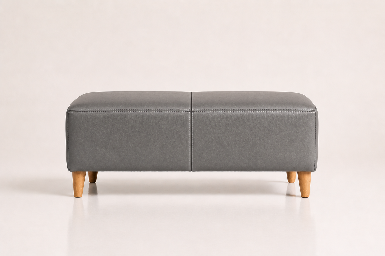 the BETTIE ottoman in grey full-grain leather (QUIET STORM)