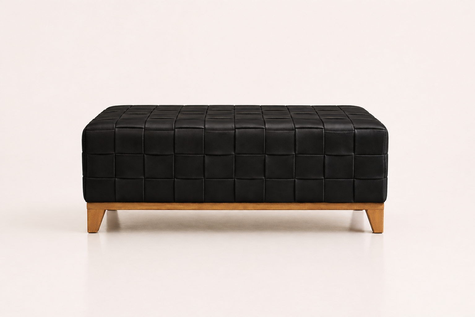 the JONATHAN ottoman in black full-grain leather (BLACK RAIN)